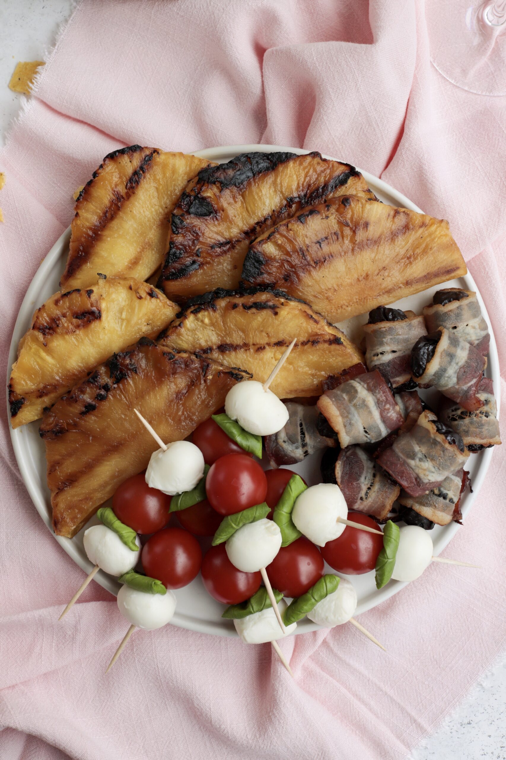 Finally a use for the giant martini glass you thought was such a great  idea! Caprese skewers!